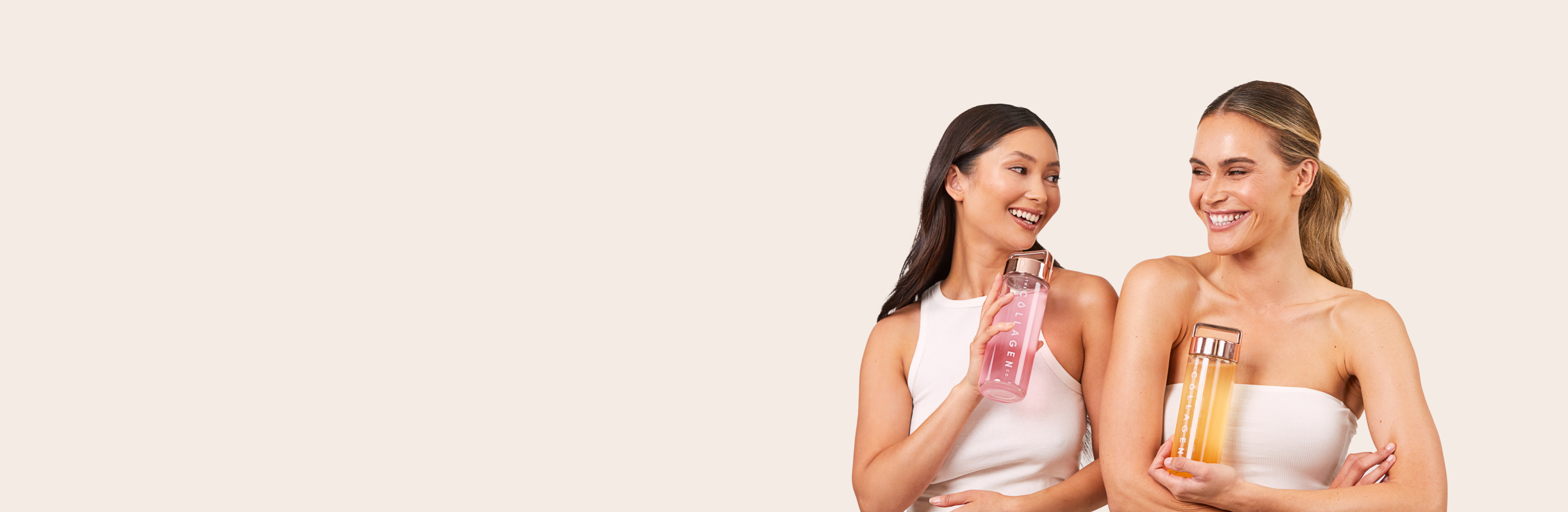 Two smiling women in white tops holding collagen supplement bottles, one pink and one orange, on a neutral background.