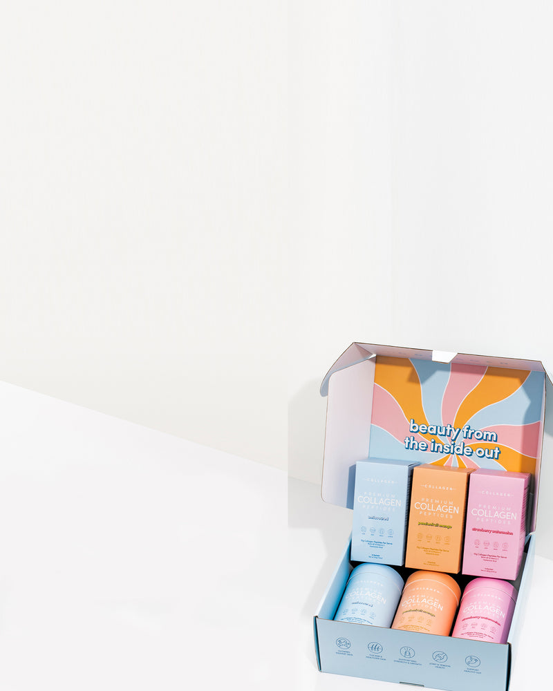 Open box with colorful collagen supplement containers, featuring vibrant packaging and text "beauty from the inside out" on the lid.