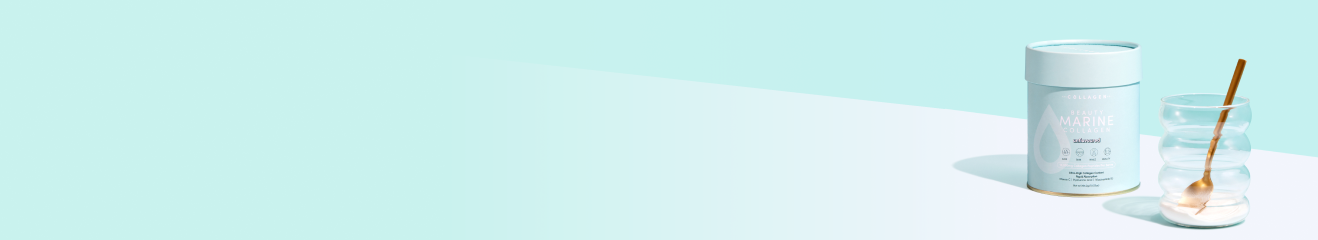 Collagen supplement jar with gold spoon and glass, set on a light aqua background, symbolizing beauty and wellness.