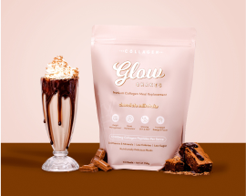Collagen supplement pouch beside a chocolate drink garnished with whipped cream, emphasizing beauty and wellness.