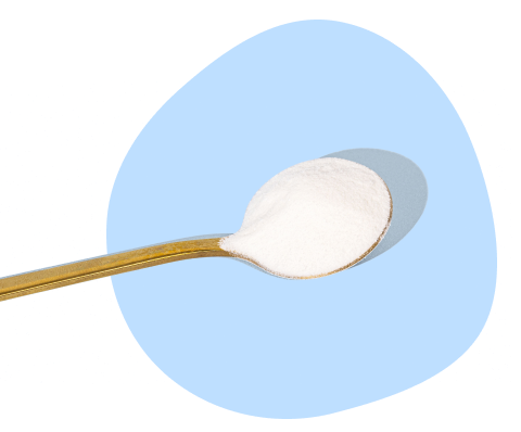 Wooden spoon with white collagen powder on a light blue background, highlighting beauty supplement concept.