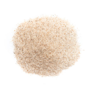 A pile of fine, beige powdered collagen supplement on a white background, highlighting its texture and beauty benefits.